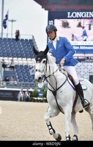 Equestrian rider allemand Christian Ahlmann en concurrence dans le Contre la montre au cours de la Shanghai Grand Prix du Global Champions Tour 2015 Longines Banque D'Images