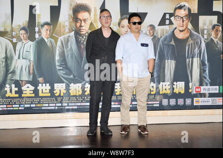 Hong Kong administration Felix Chong Man-keung, gauche, et Alan Mak Siu fai-poser qu'ils arrivent pour la première de leur film, entendu 3, à Beijing, C Banque D'Images