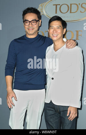 Hong Kong acteur Sean Lau, à gauche, et l'acteur Nick Cheung de Hong Kong constituent en ouverture de la partie pour Tod's 'Dots de vie' exhibition à Hong Kong, Chine, Banque D'Images
