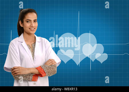 Female doctor smiling with her arms crossed Banque D'Images