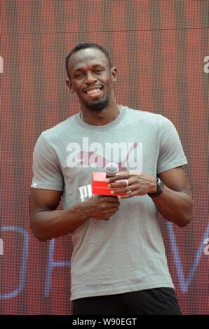 Le sprinter jamaïcain Usain Bolt sourit à un fan meeting Événement à Shanghai, Chine, 1 septembre 2014. Banque D'Images