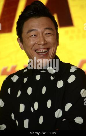 L'acteur chinois Huang Bo pose lors d'une conférence de presse de son nouveau film 'Xin Hua Lu Fang" à Shanghai, Chine, 26 août 2014. Banque D'Images