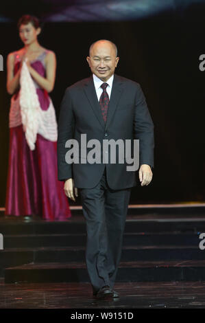 Directeur de Hong Kong John Woo arrive à la première de son nouveau film 'Le passage' à Beijing, Chine, 27 novembre 2014. Banque D'Images