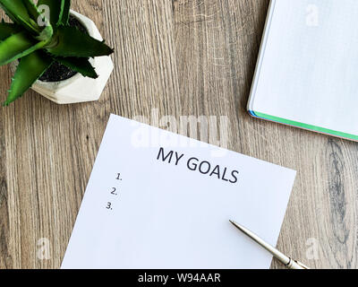 Presse-papiers avec mes objectifs sur bois 24. Banque D'Images