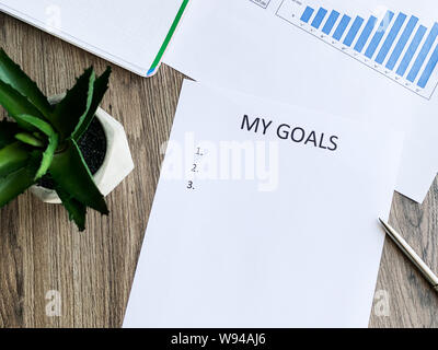 Presse-papiers avec mes objectifs sur bois 24. Banque D'Images