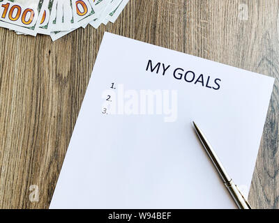 Presse-papiers avec mes objectifs sur bois 24. Banque D'Images