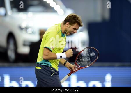 Stanislas Wawrinka de Suisse célèbre après avoir marqué contre Roger Federer de la Suisse dans leur troisième match de la mens des célibataires au cours de Banque D'Images