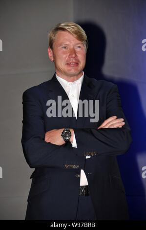 Ancien finlandais Champion du Monde de Formule 1 pilote Mika Hakkinen est photographié pendant un événement promotionnel à Shanghai, Chine, le 14 avril 2012. Banque D'Images