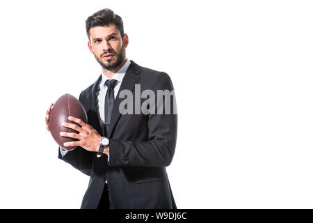 Homme d'affaires en tenue de cérémonie avec ballon de rugby Isolated On White with copy space Banque D'Images