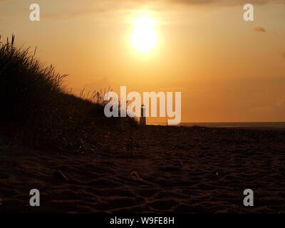 Cliché pris au coucher du soleil sur la plage de Talacre flintshire dans le Nord du Pays de Galles Banque D'Images