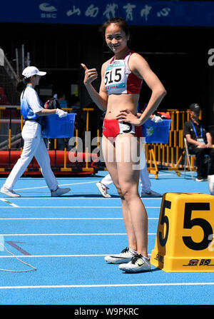 (190815) -- TAIYUAN, 15 août 2019 (Xinhua) -- Peng Yequn de région autonome Zhuang du Guangxi Délégation se prépare pour le women's 400m à la 2e Jeux de la jeunesse de la République populaire de Chine à Taiyuan, Chine du Nord, Province de Shanxi, le 15 août 2019. (Xinhua/Huang Zongzhi) Banque D'Images