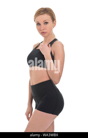 Girl standing in sport wear sur fond blanc Banque D'Images