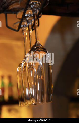 Close up of hanging champagne flutes Stock Photo