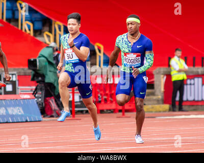 Bingtian Su de Chine et Michael Rodgers de l'United States en action lors du 100 mètres (2), au cours de la Grand Prix de Birmingham 2019 Müller, à l'Alexander Stadium, Birmingham. Banque D'Images