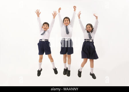 School children jumping in air Stock Photo