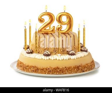 Gâteau de fête avec des bougies d'or - Numéro 29 Banque D'Images