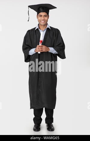 University Student holding graduation degré Banque D'Images