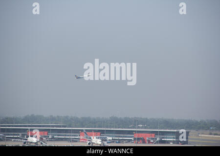 Airplane taking off on a runway, Indira Gandhi International Airport, New Delhi, India Stock Photo