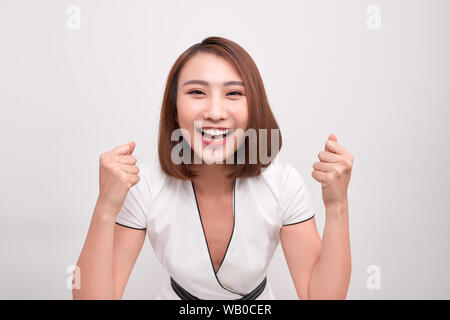 Asian woman touching her face au sentiment de surprise, de joie et de bonheur Banque D'Images