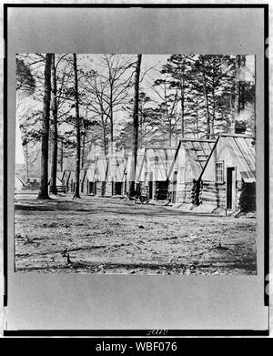 Le général Butler du siège, Fraser's Farm, côté nord de la rivière James Résumé : rangée de bâtiments en bois rond. Banque D'Images