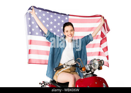 Beautiful Girl sitting on red scooter et holding American flag isolated on white Banque D'Images