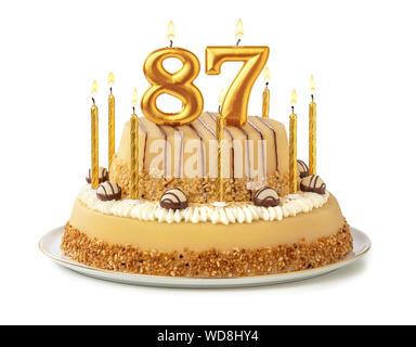 Gâteau de fête avec des bougies d'or - Numéro 87 Banque D'Images