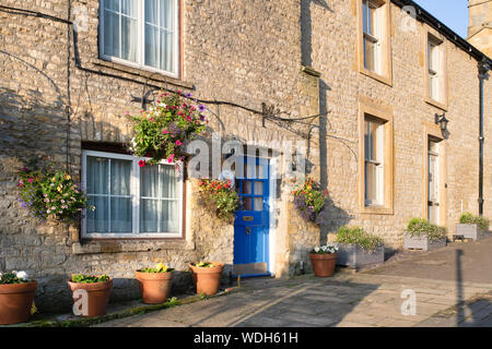 Cotswold cottage en pierre dans la lumière du matin. Sheep street, Stow on the Wold, Cotswolds, Gloucestershire, Angleterre Banque D'Images