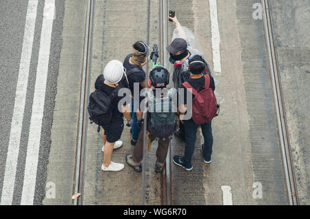 Hong Kong, 31 août 2019 - Un groupe de manifestants à Hong Kong en tant que rassemblement de black bloc de protestation Banque D'Images