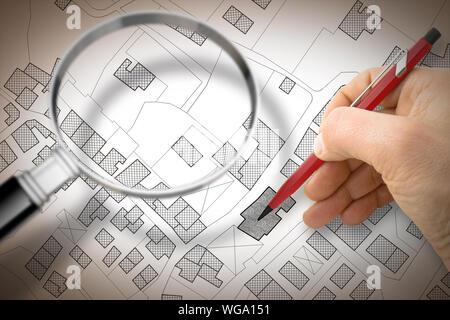 Dessin à la main une carte cadastrale du territoire imaginaire avec les bâtiments et les routes et loupe Banque D'Images