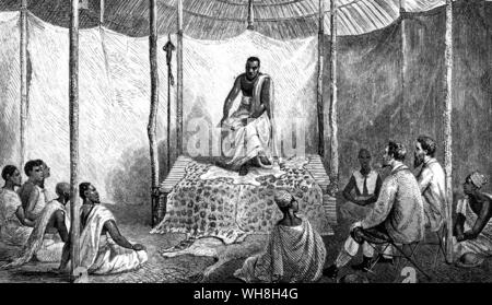 Speke et Grant Kamrasi donner sa première leçon. John Hanning Speke (1827-1864) était un officier de l'armée indienne britannique, qui effectue trois voyages d'exploration à l'Afrique. James Augustus Grant, (1827-1892) était un explorateur écossais de l'Est de l'Afrique équatoriale. En 1860, Grant a rejoint Speke en l'expédition mémorable qui a résolu le problème du Nil sources. L'aventure africaine - une histoire de l'Afrique de l'Explorers par Timothy Severin, page 233. . . . Banque D'Images