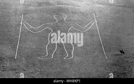 Le Long Man de Wilmington Sussex 1874. 231 ft de haut. est titulaire d'un personnel dans chaque main. Banque D'Images