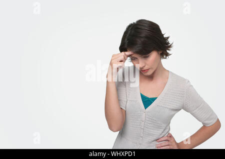 Woman with Head in Hands Banque D'Images