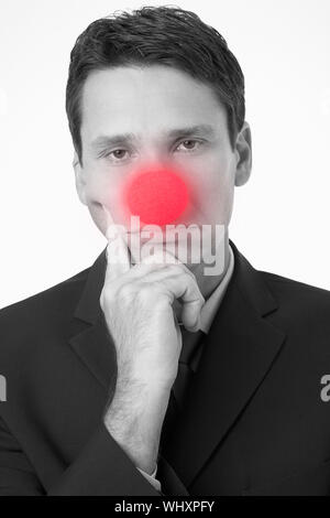 Businessman Wearing Clown Nose Banque D'Images