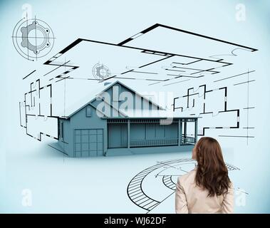 Image composite de brunette businesswoman looking at maison en 3d sur fond blanc Banque D'Images