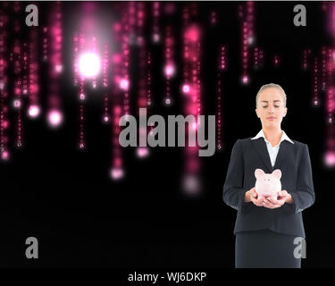 Image composite de blond businesswoman holding pink piggy bank Banque D'Images