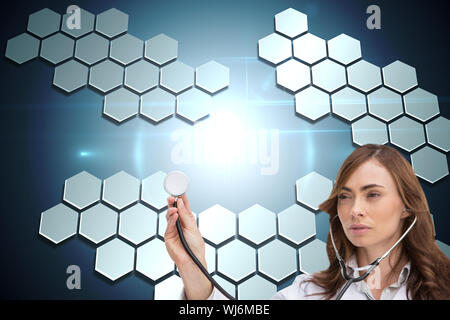 Composite image of thoughtful brunette doctor with stethoscope Banque D'Images