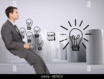 Composite image of young businessman sitting Banque D'Images