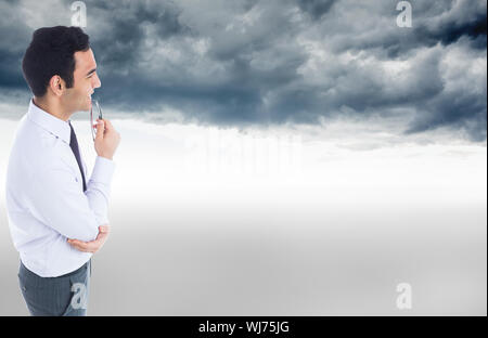 Portrait of businessman holding glasses Banque D'Images