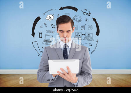 Composite image of businessman holding a tablet computer Banque D'Images