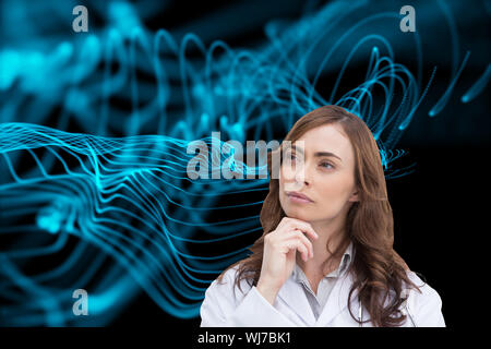 Composite image of thoughtful brunette doctor looking away Banque D'Images