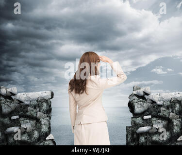 Composite image of businesswoman sitting on white background Banque D'Images