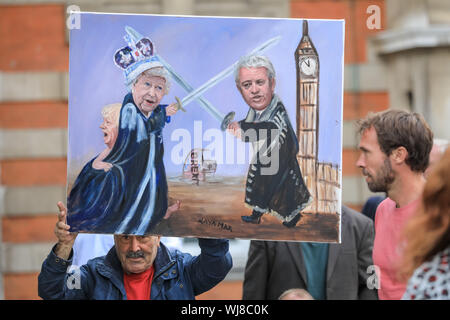 Westminster, London, UK. UK. 06Th Sep 2019. Artiste Kaya Mar contient jusqu'sa plus récente œuvre dpicting une lutte entre la Reine et le président John Bercow. Pro- Anti-Brexit et manifestants à l'extérieur du rallye Chambres du Parlement de Westminster le jour du retour des députés au Parlement et devant plusieurs débats et votes sur le potentiel d'un Brexit no-traiter, ainsi que la prorogation du Parlement. Credit : Imageplotter/Alamy Live News Banque D'Images