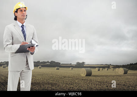 Image composite de l'architect taking notes Banque D'Images