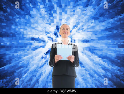 Image composite de blond businesswoman holding new tablet Banque D'Images