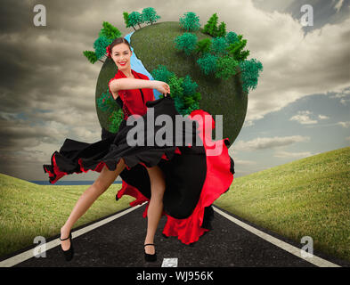 Image composite d'une femme dansant en robe rouge et noir sur un fond blanc. Banque D'Images