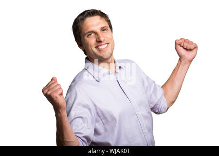 Portrait of a young businessman cheering Banque D'Images