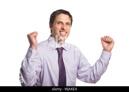 Portrait of a young businessman cheering Banque D'Images