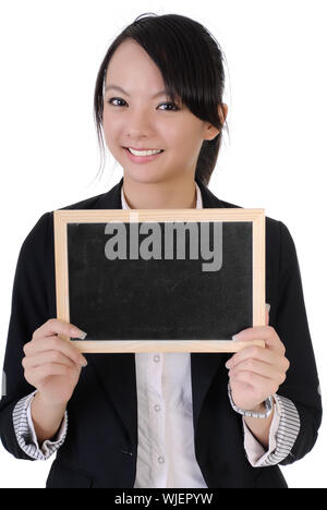 Happy smiling business girl holding blank blackboard, closeup portrait sur fond blanc Banque D'Images