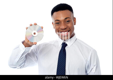 Smart male executive holding un disque compact Banque D'Images