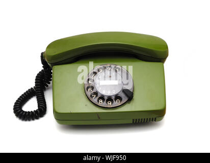 Vieux téléphone disque analogique sur fond blanc Banque D'Images